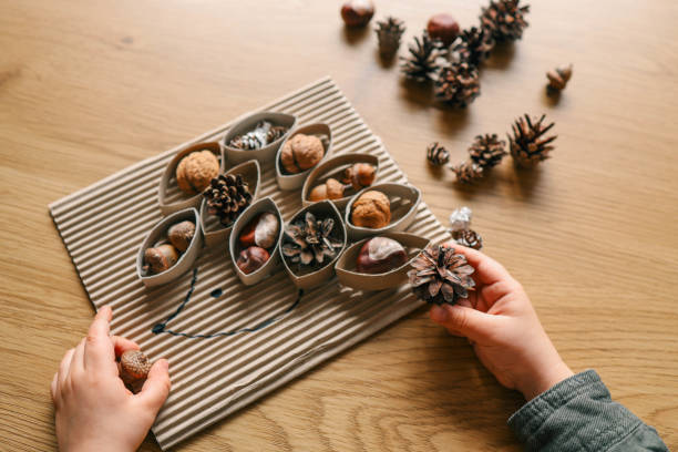istock Montessori and Sensory Development, A child plays with natural materials 2082298939