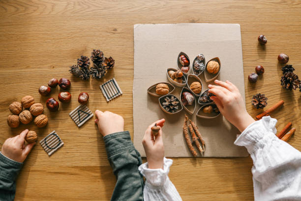 istock Montessori and Sensory Development, A child plays with natural materials 2082298950