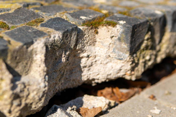 istock broken cobblestones in the sunshine 2082305633