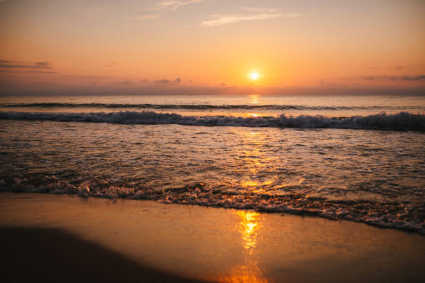 istock Ocean waves and golden sunrise. 2082316252