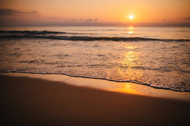 istock Ocean waves and golden sunrise. 2082316254