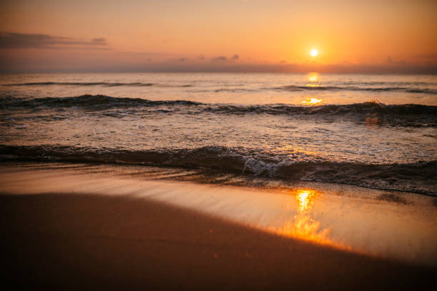 istock Ocean waves and golden sunrise. 2082316258