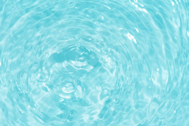 istock Blue water surface texture with ripples, splashes, and bubbles. Abstract summer banner background Water waves in sunlight with copy space cosmetic moisturizer micellar toner emulsion. Blue water wave. 2082316285