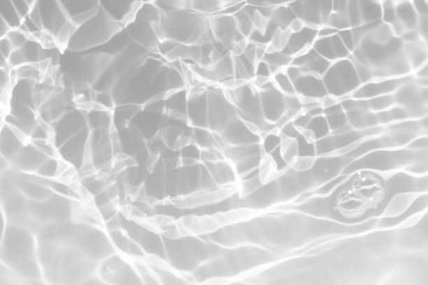 istock White water surface texture with ripples, splashes, and bubbles. Abstract summer banner background Water waves in sunlight with copy space cosmetic moisturizer micellar toner emulsion. White water. 2082316803