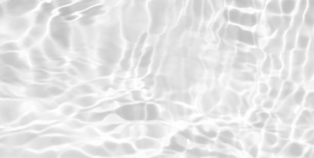 istock White water surface texture with ripples, splashes, and bubbles. Abstract summer banner background Water waves in sunlight with copy space cosmetic moisturizer micellar toner emulsion. White water. 2082316809