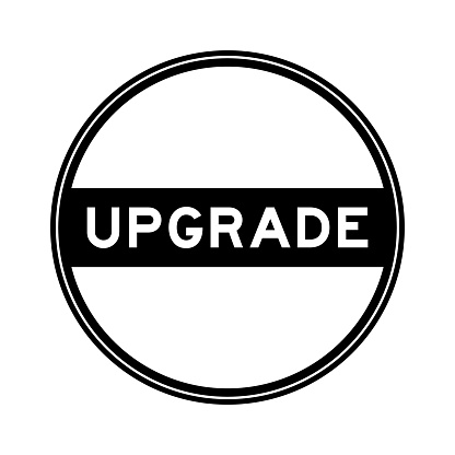 Black color round seal sticker in word upgrade on white background