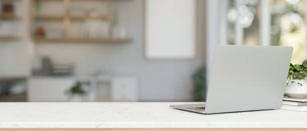 istock A back view image of a laptop computer on a white tabletop in a contemporary office. 2082372655