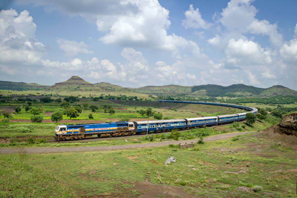 istock 24 coaches long Express passenger train passing over a huge curve in a place named Daundaj, Maharashtra, India. 2082381579