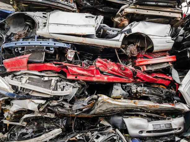 Pile of Crushed Cars in a Junkyard