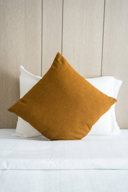 istock Brown cushions and cozy bed with soft pillows 2082406368