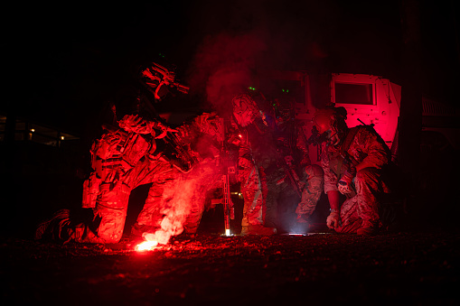 journalists in a war zone film soldiers and give an interview