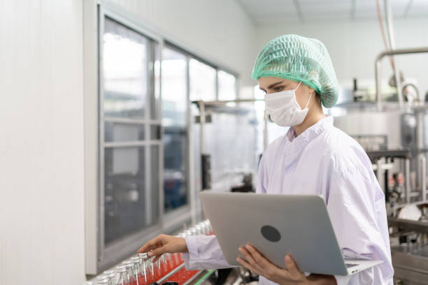 istock quality inspector food or beverages technician inspection about quality control food or beverages before send product to the customer. Production leader recheck ingredient and productivity. 2082497323