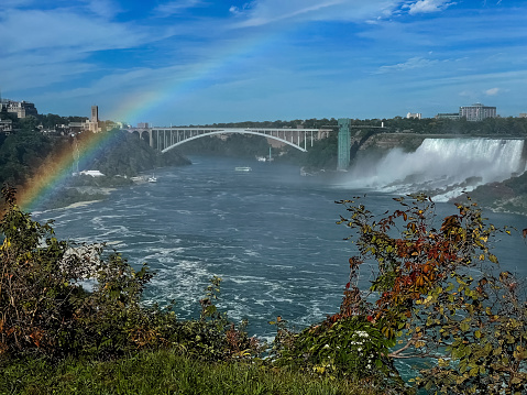 Niagara Falls and rainbow over it in autumn, Ontario, Canada.