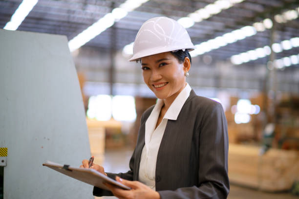istock Blue collar worker is working at wood factory. 2082623369
