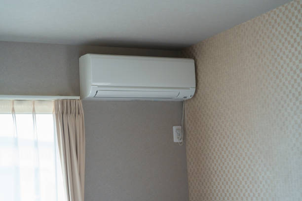 Air conditioner on wall background at home