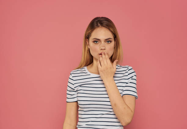 istock Happy blonde on pink background gesturing with hands Copy Space positive gesture 2082750545