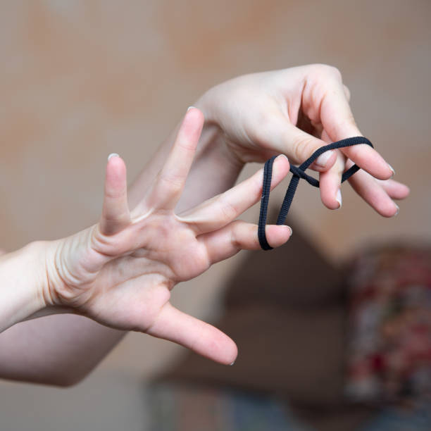 istock Hands Tying Elastic Hair Band in a Knot 2082773075