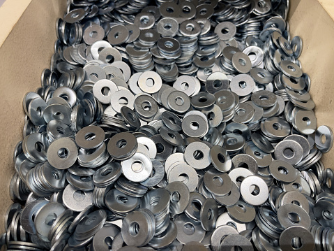 Metal fasteners placer at the construction store. Metal washers.