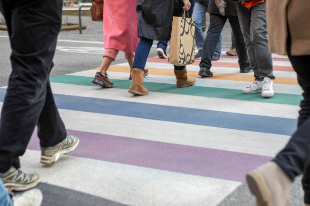 istock Pedestrians walking over a zebra crossing 2082812360