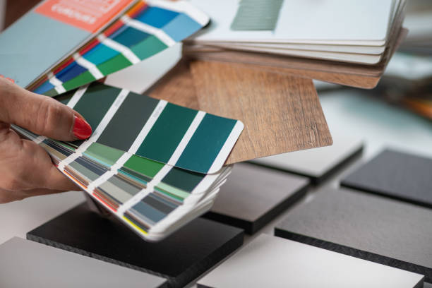 istock A skilled interior designer carefully matches color samples, selecting compact boards for a harmonious palette 2082826167