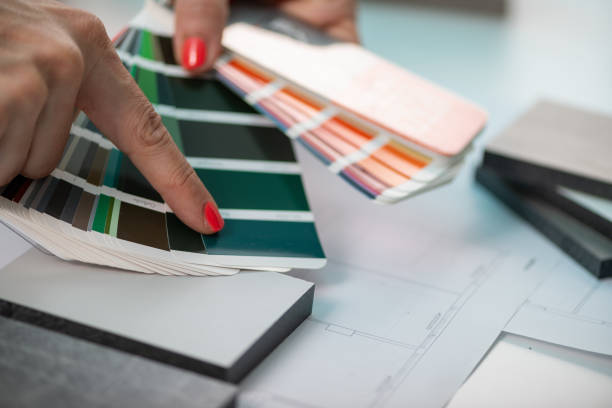 istock An interior designer meticulously curates color samples, including compact boards, for a harmonious color palette 2082827216
