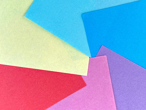 Stack of Colorful Post it Notes on Green Background