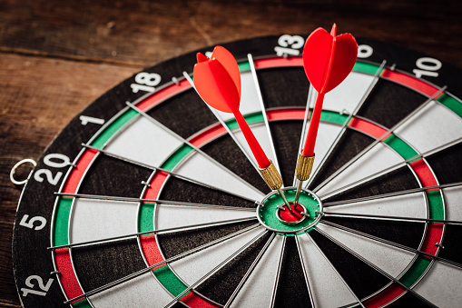 The darts on wooden background