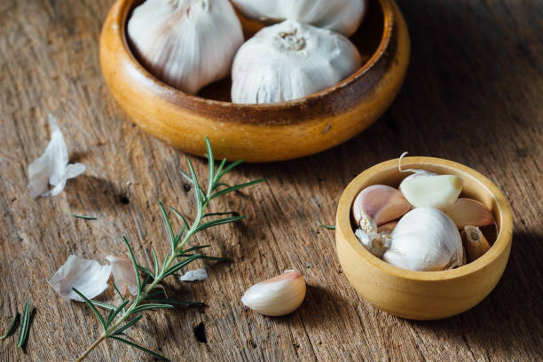 garlic on wooden background stock photo