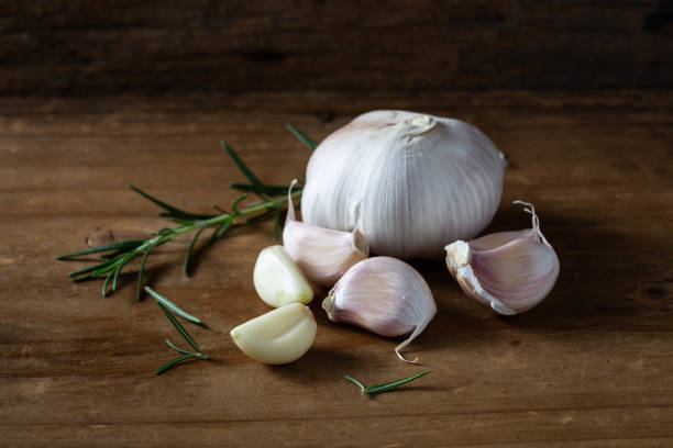 garlic on wooden background stock photo