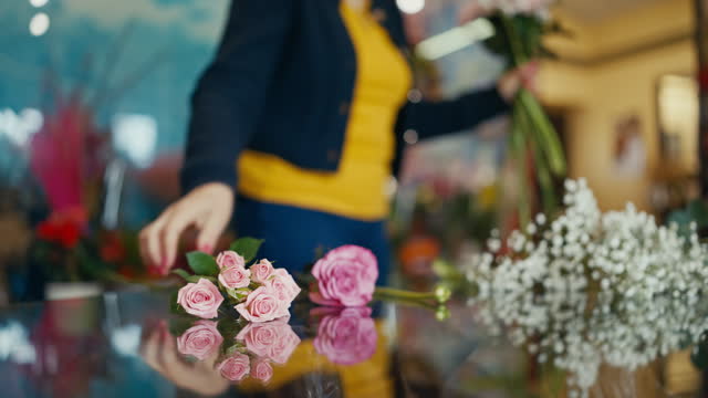 Mature Female Entrepreneur Making Beautiful Bouquet with Different Flowers at Shop