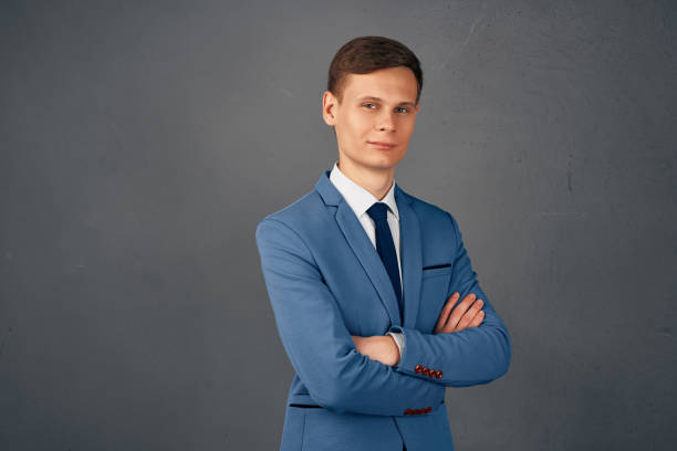 istock handsome business man in suit folded his hands in front of him work office 2082949262