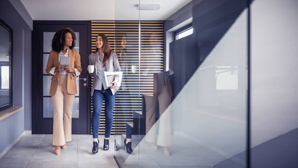 istock Two female colleagues have small talk during break 2082959476