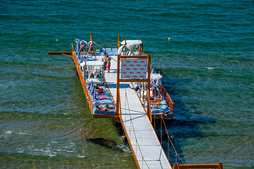 İstanbul, Turkey - June 22, 2013: The pier of the beach on the Black Sea coast of Istanbul Kilyos.