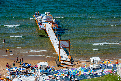 İstanbul, Turkey - June 22, 2013: Beach and pier on the Black Sea coast of Istanbul Kilyos.