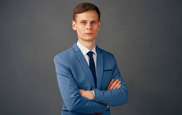 istock handsome business man in suit folded his hands in front of him work office 2082974888