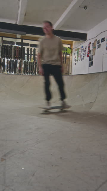 Skateboarding Crew Riding in Bowl at Skatepark