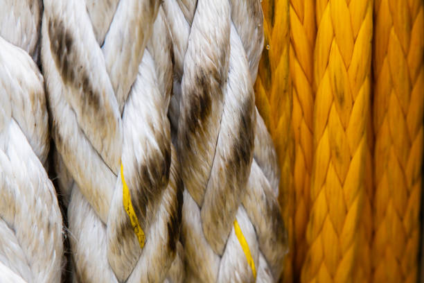 Mooring ship rope wound on a winch, close-up.