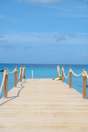 Curacao Caribbean Island, wooden pier in the ocean at Kokomo Beach at the Caribbean island of Curacao