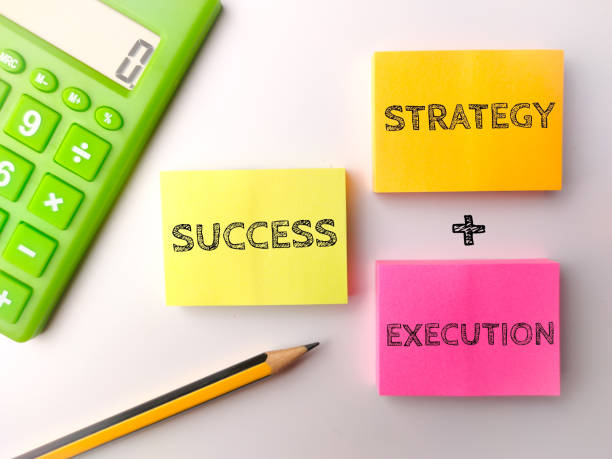 istock Calculator and pencil with the word STRATEGY EXECUTION SUCCESS 2083010340