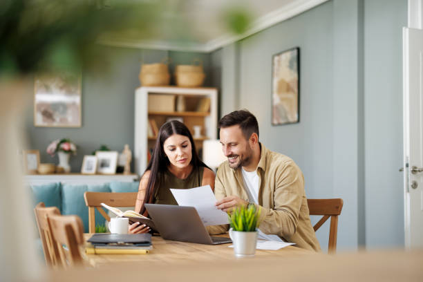 istock Couple at home office with laptop 2083034524