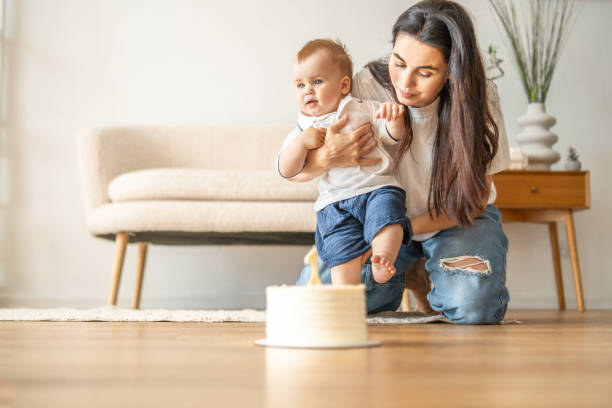 istock Woman Playing With Baby on Floor 2083040580