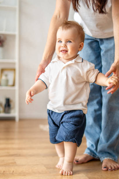 istock Woman holding babys hand 2083040617