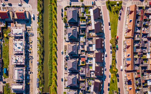 Dutch Suburban area with modern family houses, newly build modern family homes in the Netherlands, dutch family houses in the Netherlands, newly build streets with modern houses.