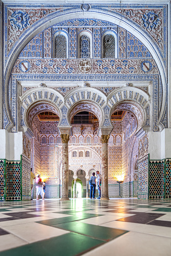Majestic Arches and Intricate Tilework Inside the Historic Alcazar Palace, Seville, Spain