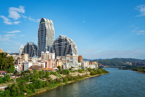 Xishuangbanna Jinghong City Cityscape Lancang River and buildings on both sides, cityscape of Xishuangbanna, Yunnan, China. xishuangbanna stock pictures, royalty-free photos & images