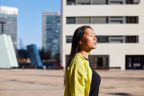 istock Urban Determination: Young Asian Executive Navigates Financial District with Confidence 2083095225