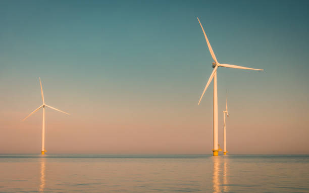 istock offshore windmill park with stormy clouds and a blue sky, windmill park in the ocean. Netherlands 2083123941