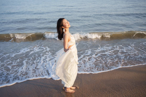 Free Stock Photo of Woman Standing in Water Wearing White Dress ...