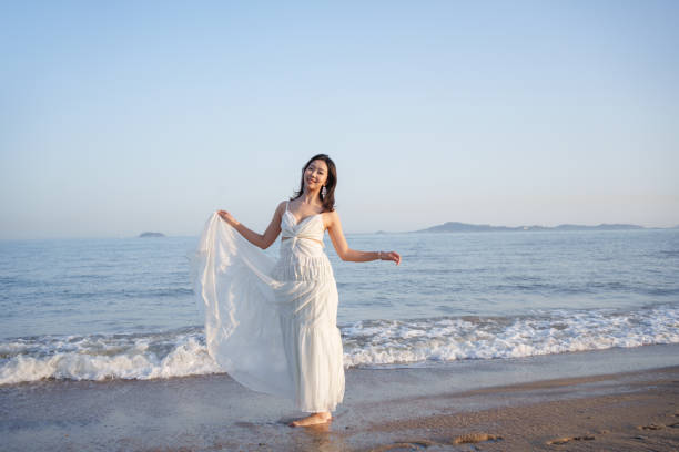 Woman in white dress outdoors in Greece decoration. High quality photo