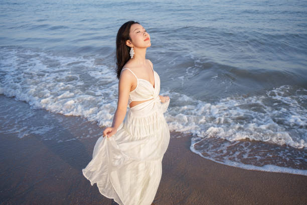 Free Stock Photo of Woman Standing in Water Wearing White Dress ...